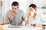 A cheerful couple is having breakfast together