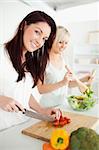 Cute Women preparing dinner in a kitchen