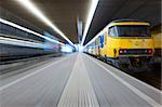 Trying to catch a departing train from a platform at a train station