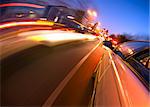 A car driving in the busy downtown streets, anticipating oncoming traffic