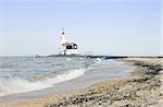 The lighthouse on the Peninsula of Marken on the IJsselmeer, the Netherlands, aptly called "het paard van Marken", dating back to the 16th Century