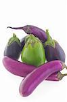 Group of different shape and color eggplants (aubergines) isolated on white background.