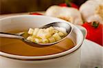 photo of delicious hot noodles soup on wooden table