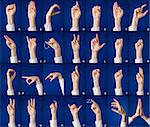 Finger spelling of alphabet in sign language, on blue background