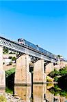 train on railway viaduct in Douro Valley, Portugal