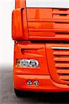 front of orange truck