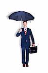 Happy manager standing with a case under umbrella