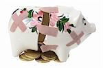 Broken Piggy Bank and Coins on White Background