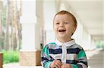 Close-up portrait oa smiling young baby outdoors