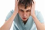 A teen boy showing signs of a headache, migrain or stress.