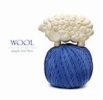 Blue ball of woollen thread isolated on white with lamb figure soap on it