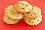 five fresh appetizing oatmeal cookies over red background