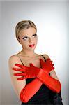 Portrait of sexy fashion woman with red lips and gloves looking up. white background