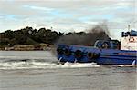 tug boat on the river shannon at foynes in ireland with diesel fumes