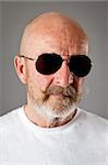 An old man with a grey beard sunglasses