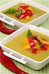 Puree soup with peppers in white porcelain cups.