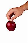 Red delicious apple in a hand isolated on a white background.