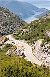 Aerial view on hairpin road to Risan. Montenegro. In background bay of Kotor.