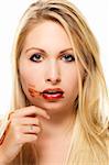 beautiful blonde woman after eating chocolate on white background