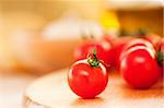 Cherry tomato on a wooden board. Shallow depth of field