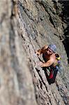 Male rock-climber  on a granite wall