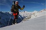 Ski touring in winter mountains. Outdoor pursuit