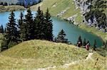 Male and female hikers in the German Alps climbing a hill