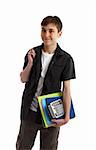 A smiling teenage student carrying folders books and a calculator.