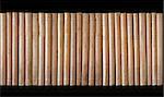Row of vintage beige dirty books in  bookcase