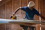 Carpenter using a circular saw