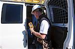 Engineer getting test equipment from the back of his truck