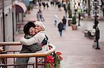 Mother and daughter hugging each other at a marketplace, Boston, Massachusetts, USA