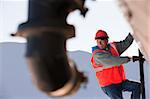 Engineer climbing the ladder of tanker truck