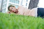 Woman napping in grass