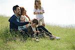 Family relaxing together outdoors