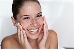 Woman scrubbing sugar on her face