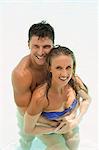 Couple hugging in swimming pool