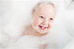 Toddler playing in bubble bath