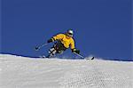 Skier on snowy mountain slope