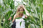 Young woman in cornfield