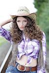 Junge Frau als cowgirl