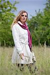 Young woman in white trench coat