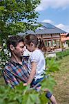 Father with daughter in front of Lehner energy house, Poing, Bavaria, Germany, Europe