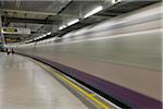 Train Passing Through Subway Station, London, England