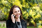 Close-up of young woman talking on cell phone