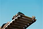 Woman sunbathing on deckchair