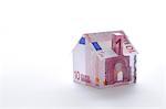 Model house folded with euro banknote