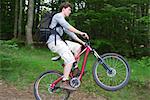 Man performing wheelie on mountain bike