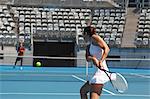 Young Male and Female Tennis Players Practicing