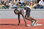 Coureur masculin au bloc de départ